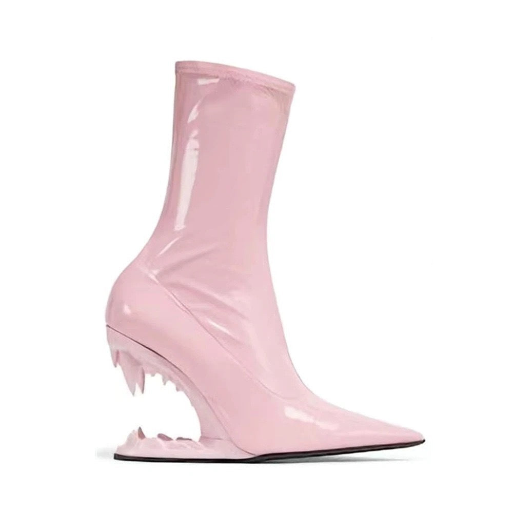 Pink high-heeled rain boot with a unique design on a white background