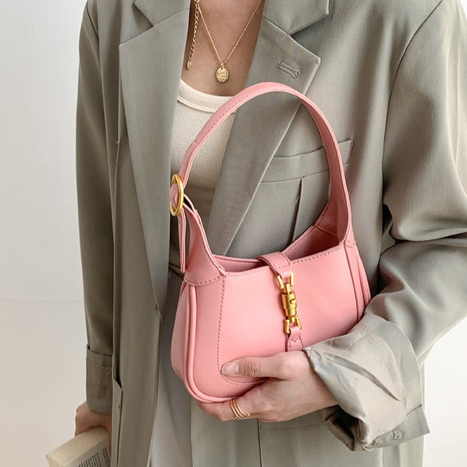 Pink Classic Curved Leather Handbag with Signature Buckle Closure
