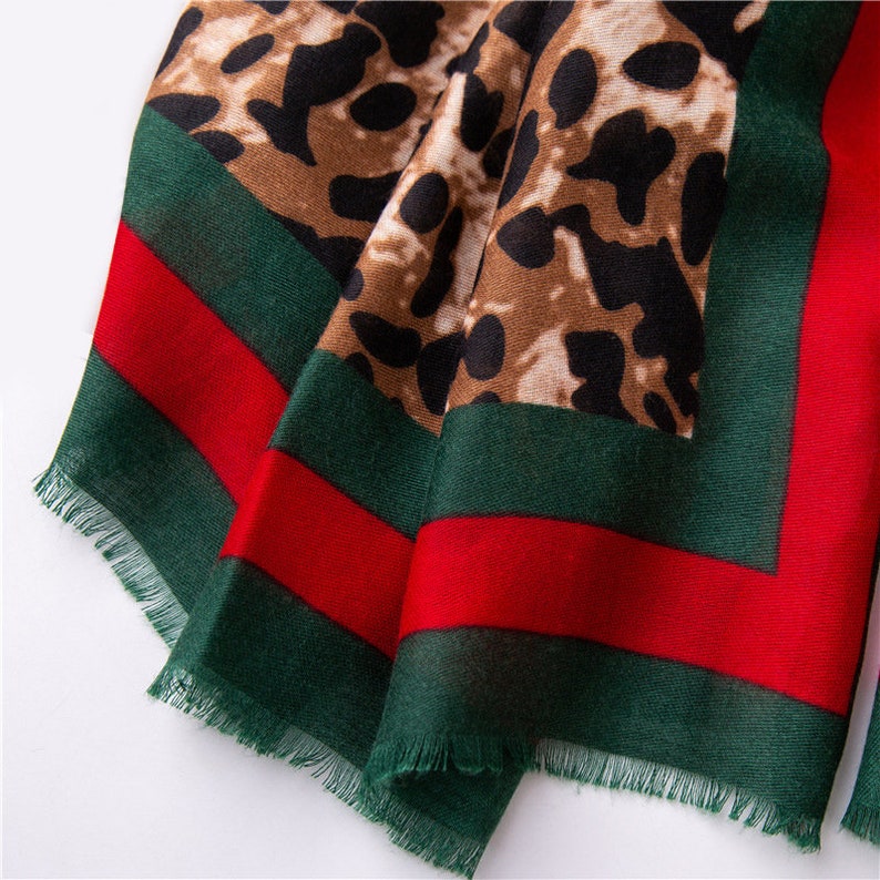 Leopard Print Scarf With  A Red And Green Trim